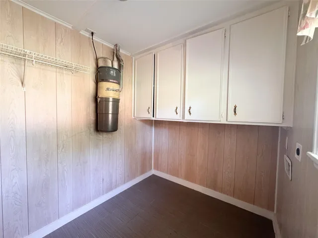 a kitchen with refrigerator and window