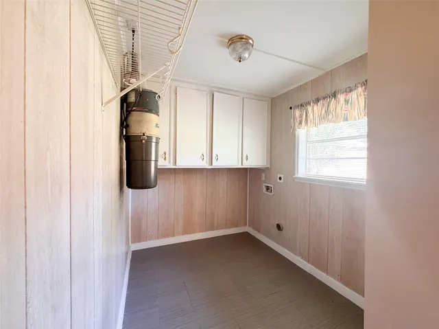 a view of a room with window and a ceiling fan