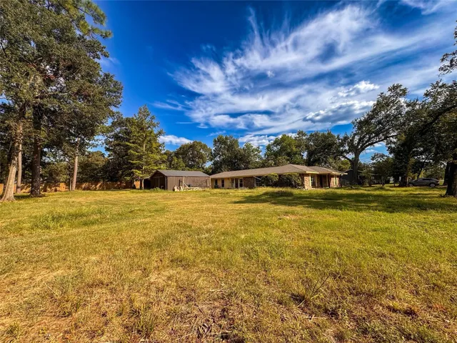 a view of swimming pool with an outdoor space and seating area