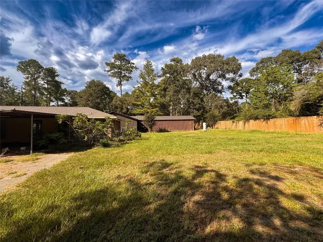 a view of swimming pool with an outdoor seating