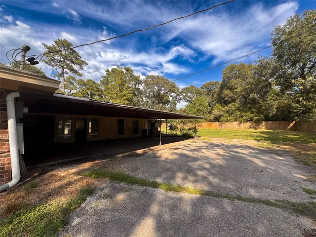 a view of a swimming pool with a yard