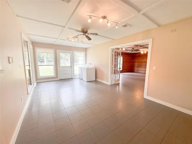 a view of an empty room with a window