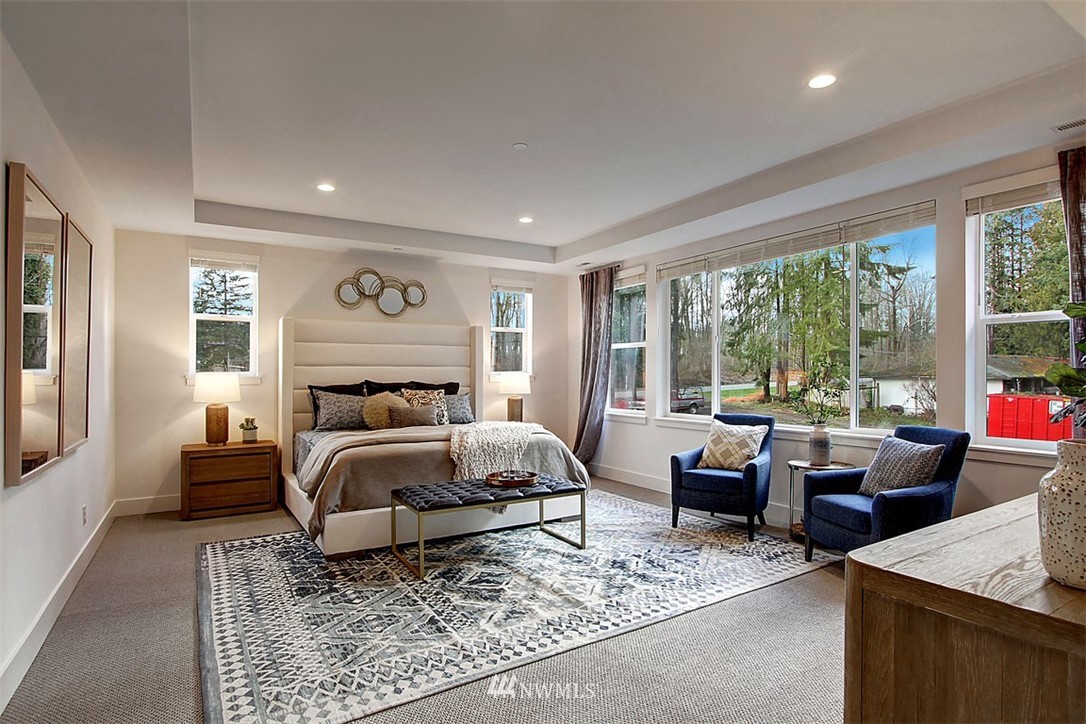 35 232nd Place Southeast Bothell, WA 98021 - Photo 16 of 24 a bedroom with a bed and glass window