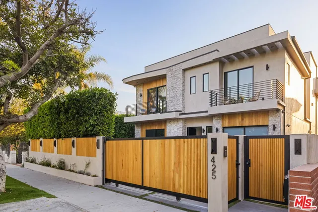 a front view of a house with glass windows