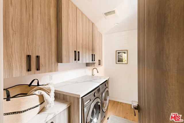 a bedroom with a bed and large window