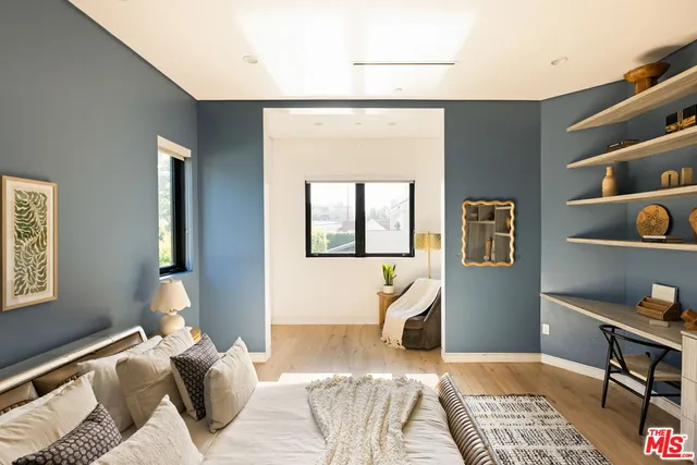 a bedroom with a bed and a cabinets