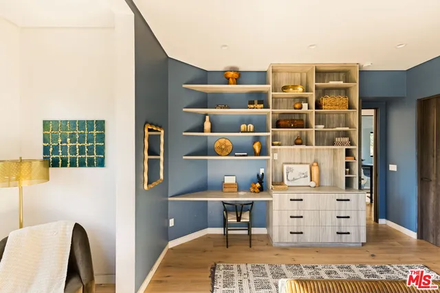 a view of a terrace with couches and city view