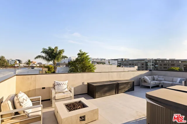 a bedroom with a bed and flat screen tv