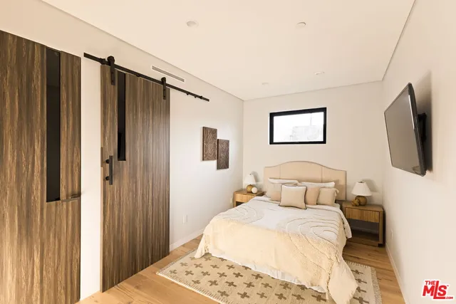 a living room with furniture and stairs