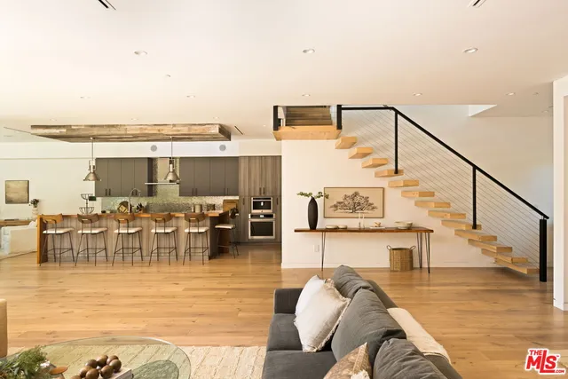 a kitchen with stainless steel appliances a sink and cabinets