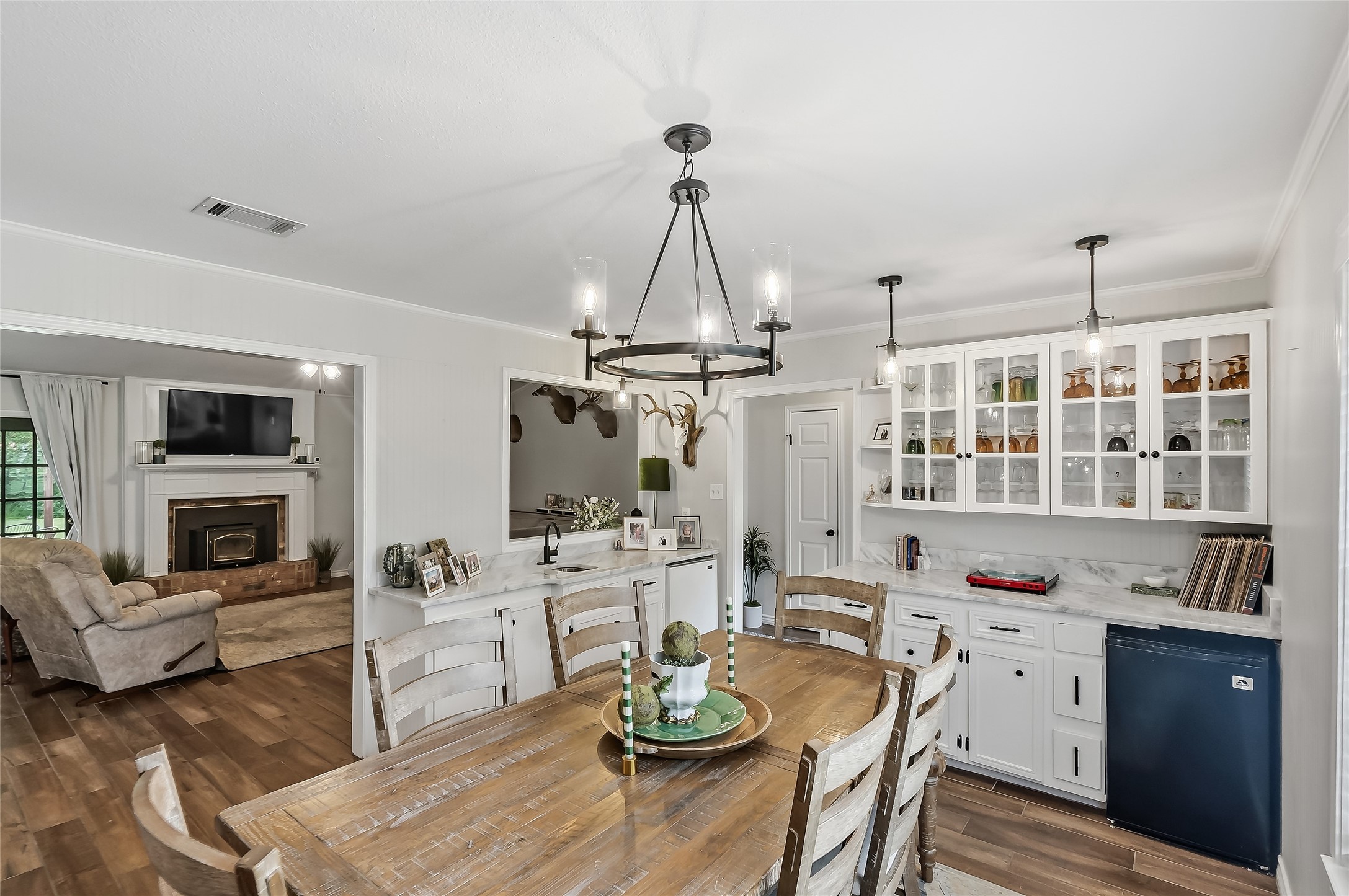 906 Standley Road Madisonville, TX 77864 - Photo 11 of 40 a kitchen with white cabinets and appliances