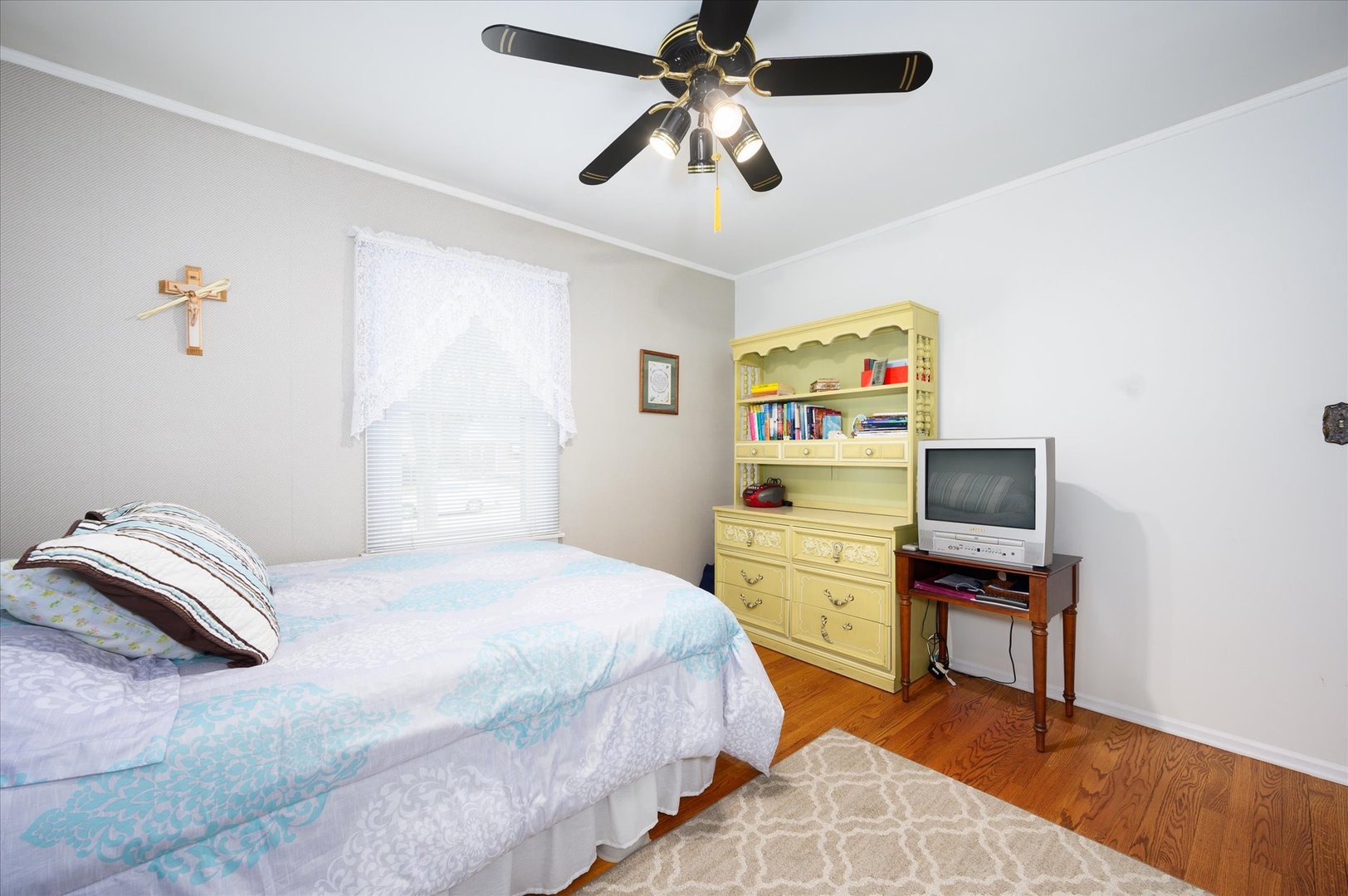 1512 Herbert Avenue Berkeley, IL 60163 - Photo 17 of 33 a bedroom with a bed and a chandelier