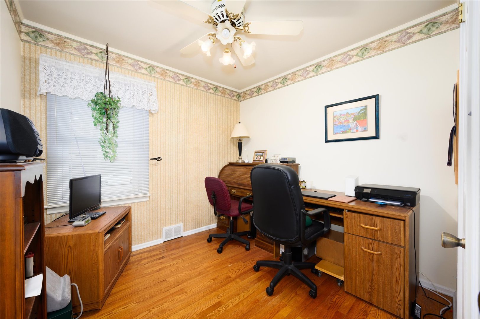 1512 Herbert Avenue Berkeley, IL 60163 - Photo 19 of 33 a view of a workspace with furniture and a window