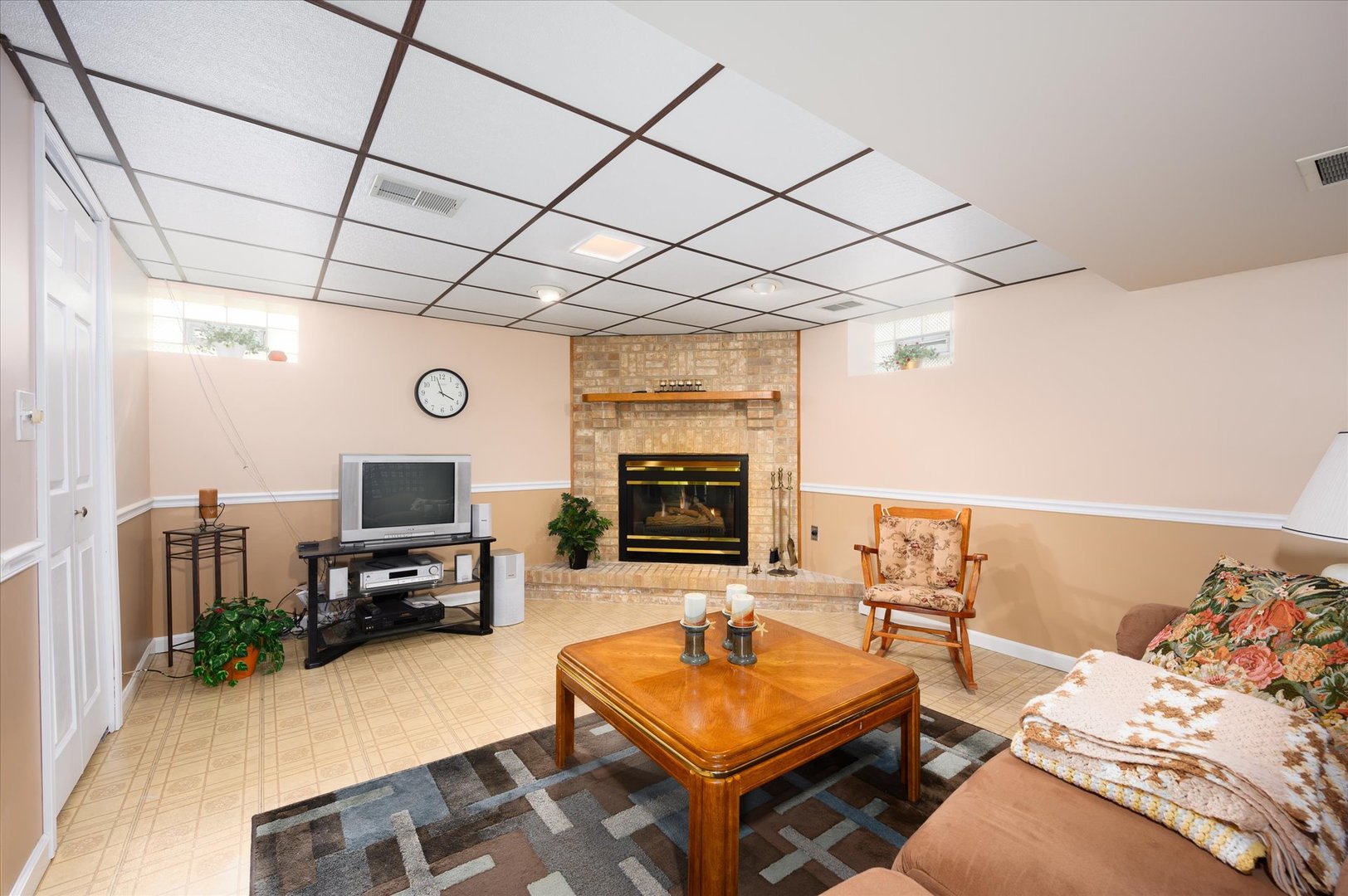 1512 Herbert Avenue Berkeley, IL 60163 - Photo 20 of 33 a living room with furniture a flat screen tv and a fireplace