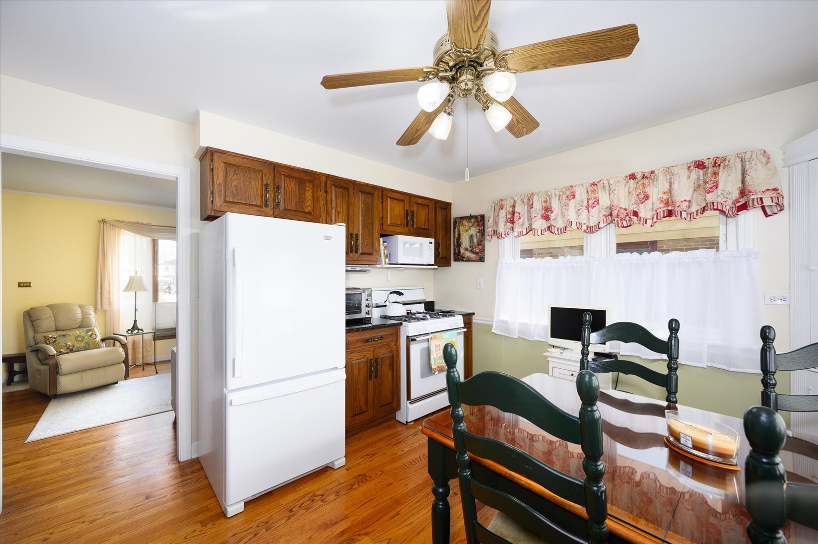 1512 Herbert Avenue Berkeley, IL 60163 - Photo 9 of 33 a view of a dining room with furniture a chandelier and wooden floor