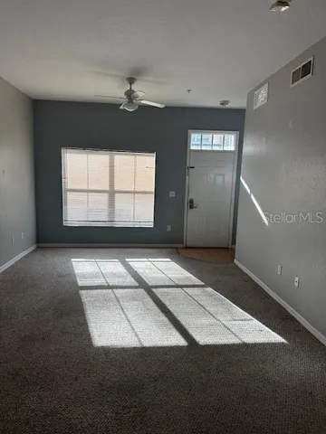 a view of an empty room with a window