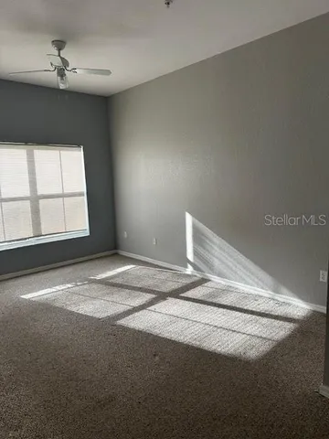 a view of empty room with windows