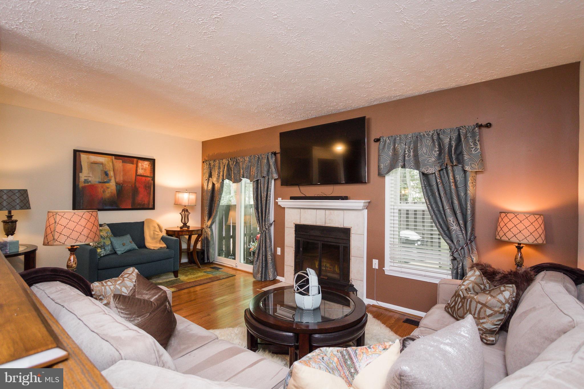 7381 Stream Way Springfield, VA 22152 - Photo 4 of 26 Enjoy your wood burning fireplace.
