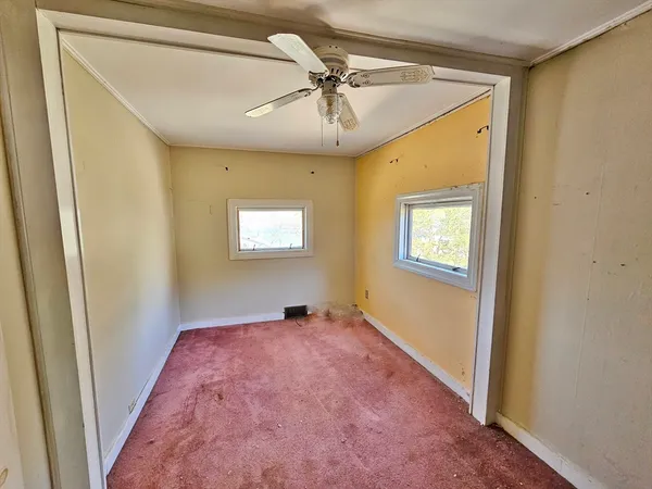 a bathroom with a toilet a sink and a mirror