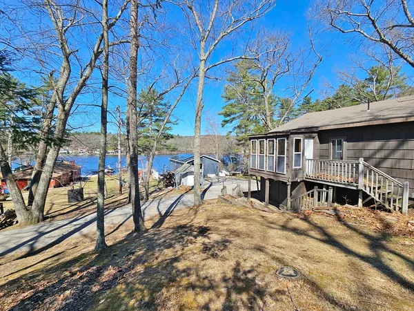 a view of house with a yard