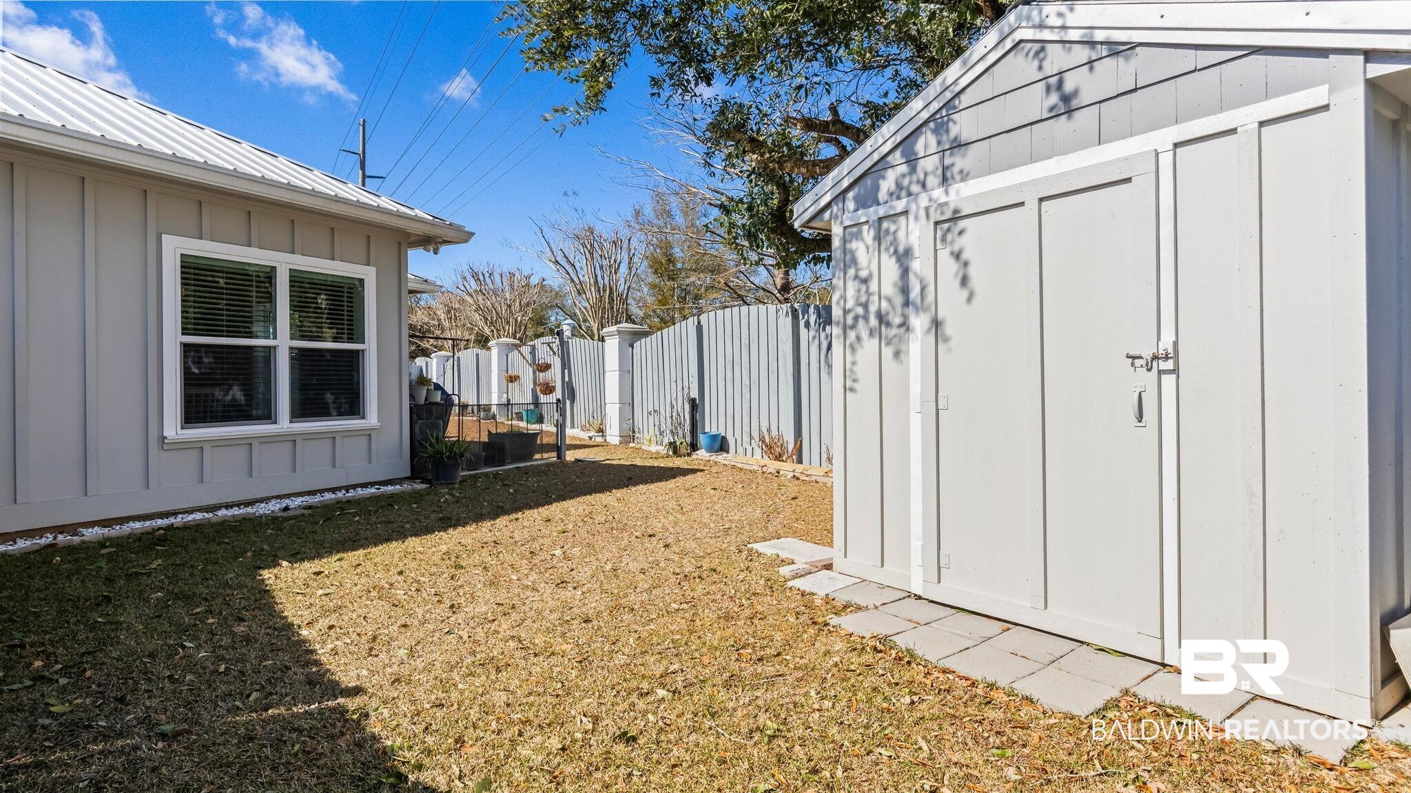 8013 Carmel Circle Foley, AL 36535 - Photo 32 of 49 Fenced backyard with a storage unit
