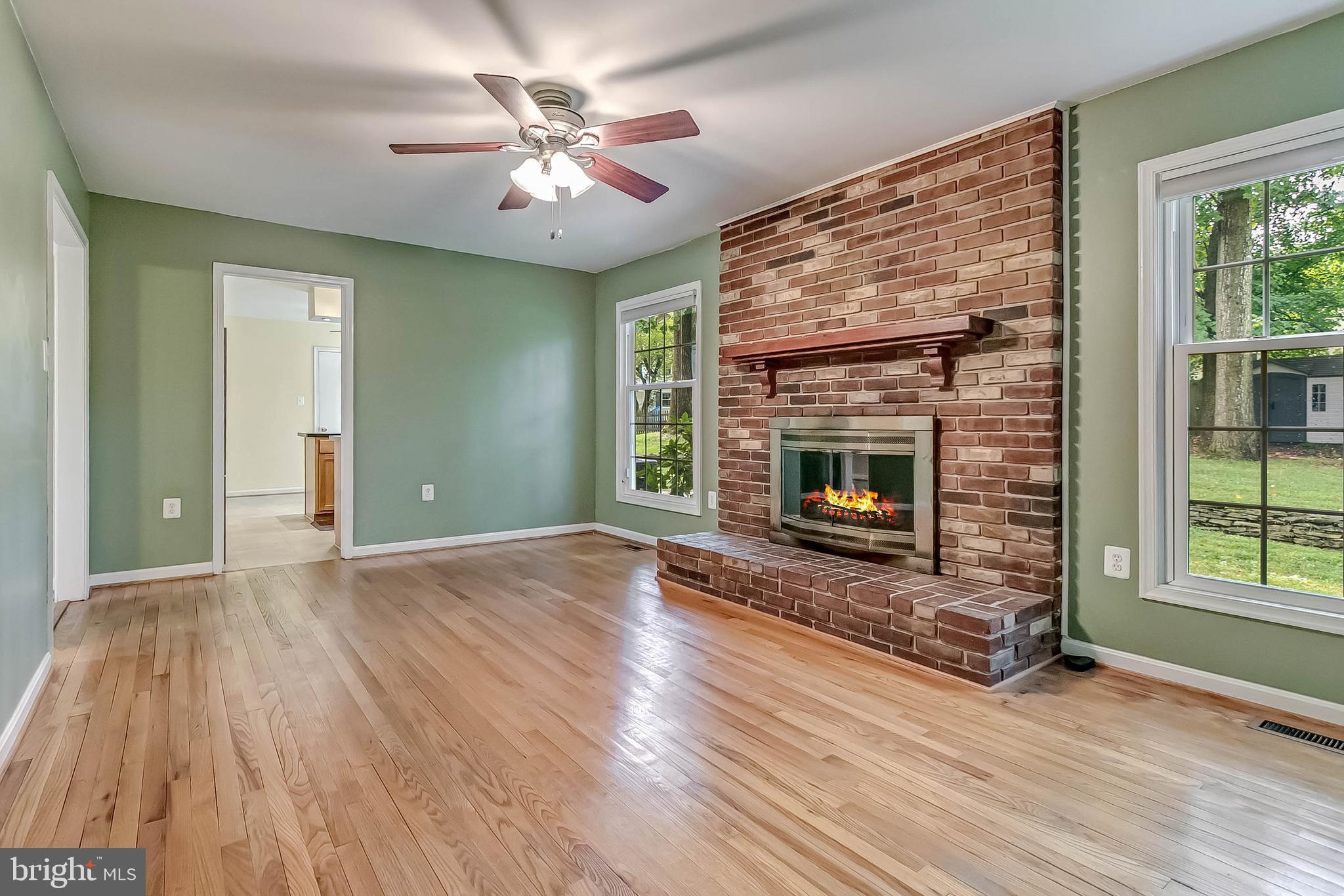 2908 Bluff Point Lane Silver Spring, MD 20906 - Photo 18 of 63 Family room with wood burning fireplace