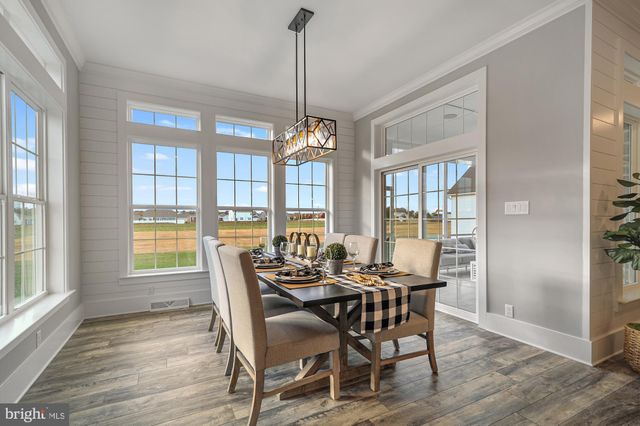 a dining room with furniture window wooden floor