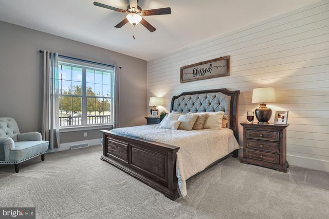 a bed room with a bed and a couch