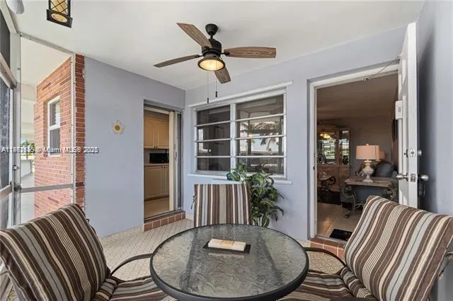 a view of a livingroom with furniture window and wooden floor