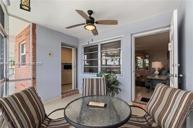 161 Northeast 10th Avenue, Unit 7C Hallandale Beach, FL 33009 - Photo 20 of 27 a view of a livingroom with furniture window and wooden floor