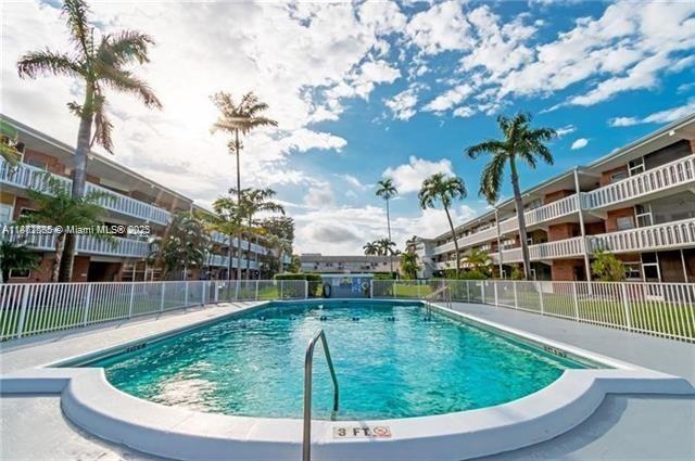 161 Northeast 10th Avenue, Unit 7C Hallandale Beach, FL 33009 - Photo 25 of 27 a view of yard with swimming pool and outdoor seating