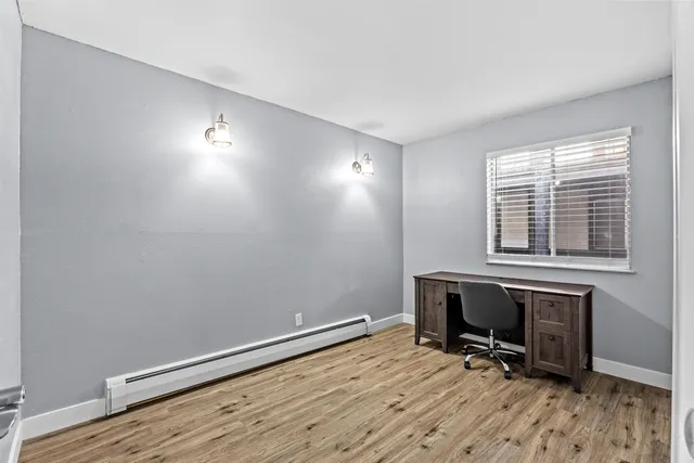 a view of workspace with wooden floor and chair