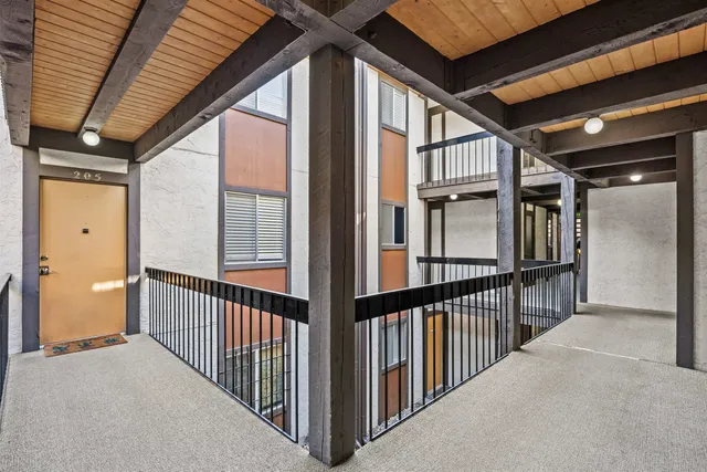 a view of staircase with large windows