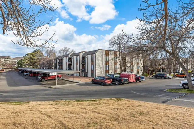 a view of street with parked cars