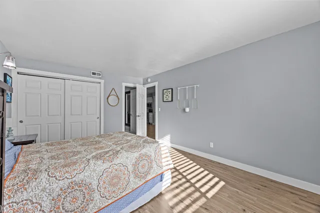 a bedroom with a bed and a walk in closet