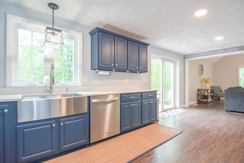 146 Gray Road Templeton, MA 01468 - Photo 4 of 37 a kitchen with granite countertop wooden cabinets a sink a window and appliances