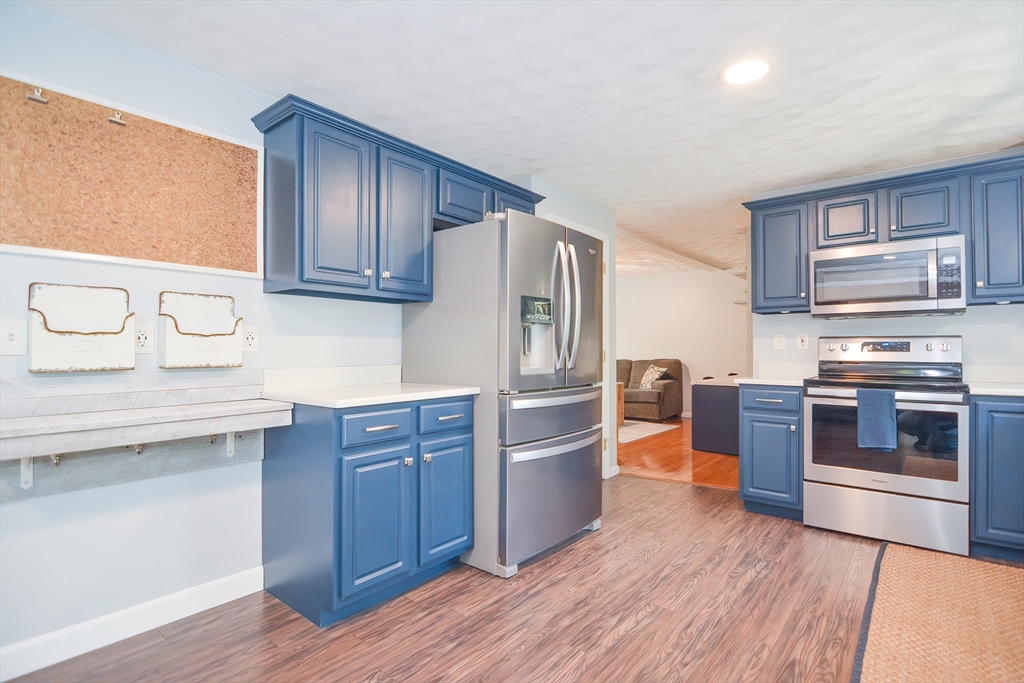 146 Gray Road Templeton, MA 01468 - Photo 5 of 37 a kitchen with stainless steel appliances and wooden cabinets