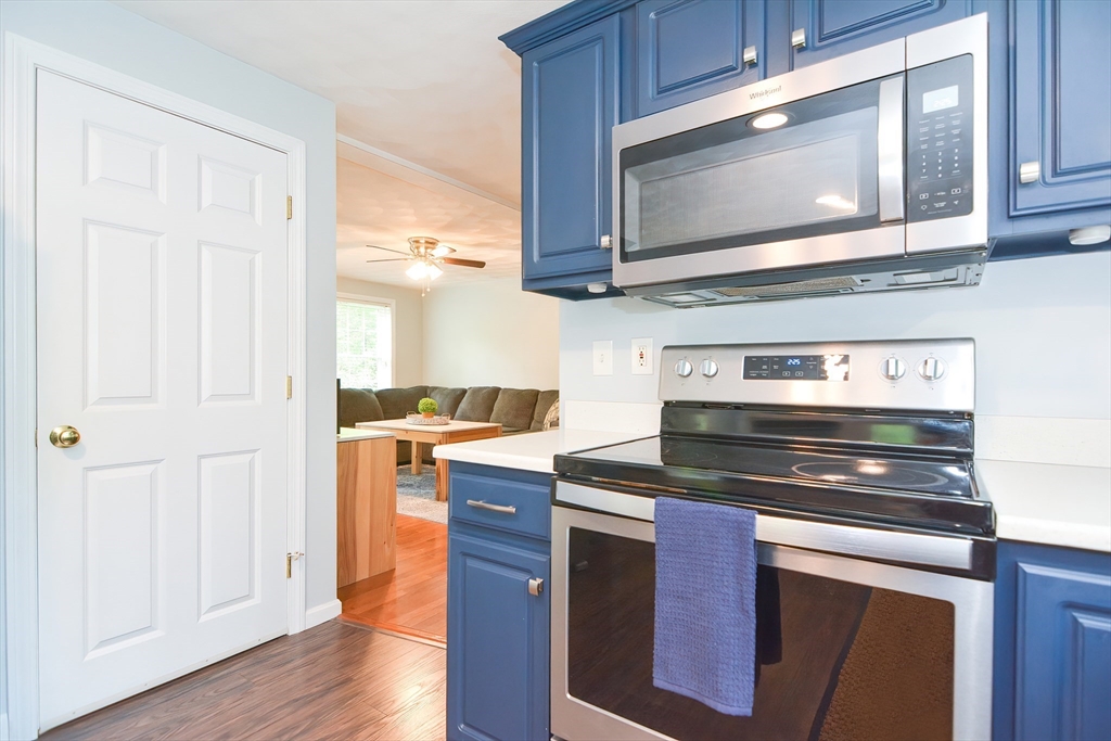 146 Gray Road Templeton, MA 01468 - Photo 6 of 37 a kitchen with stainless steel appliances granite countertop a stove microwave and cabinets