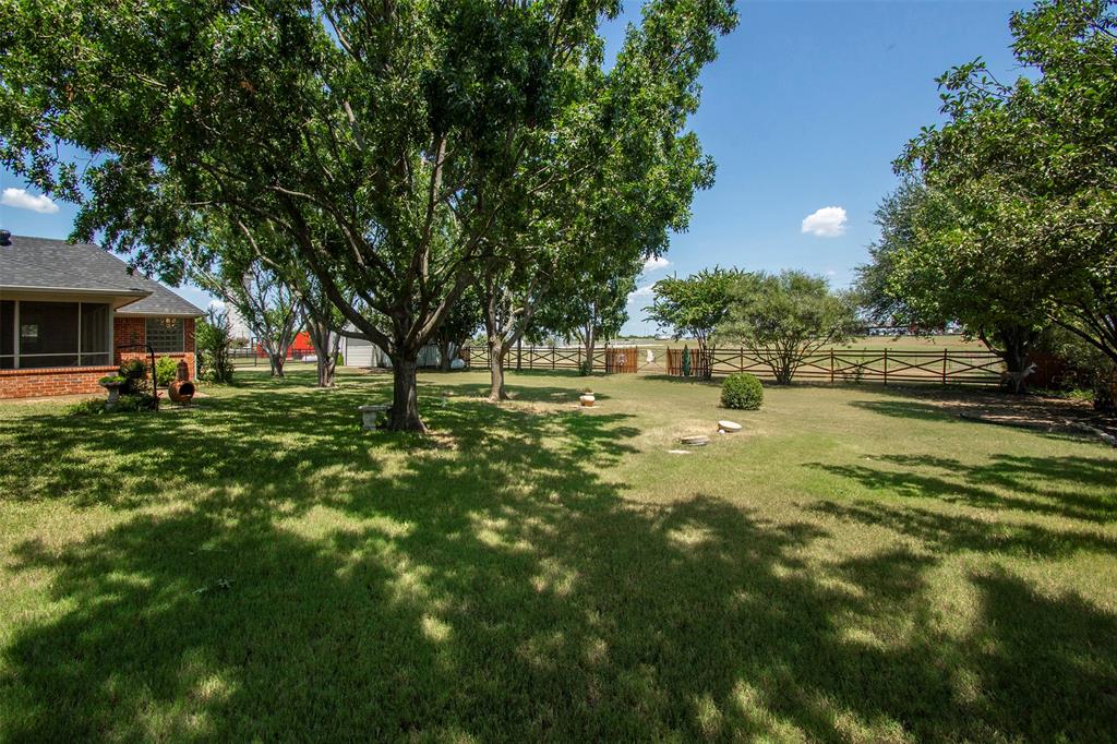 100 Durning Road Van Alstyne, TX 75495 - Photo 22 of 28 Private backyard with mature trees