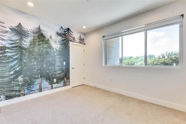 a view of a room with a large window