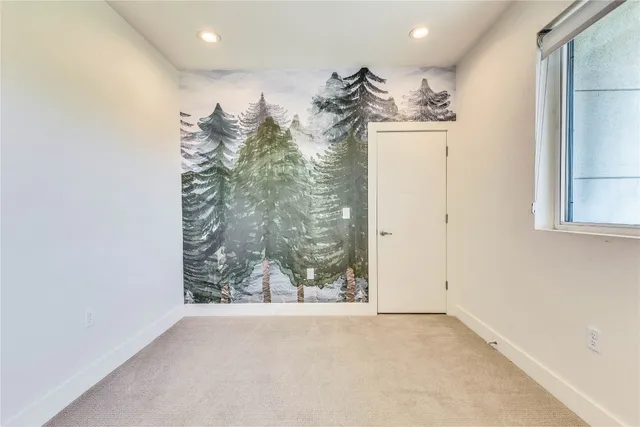 a bathroom with a sink a toilet a mirror and shower