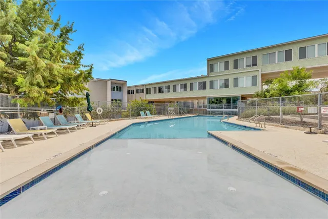 a view of a kitchen with a large window