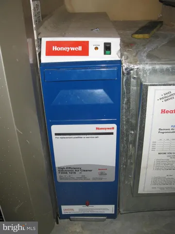 a kitchen with granite countertop a stove a sink and a microwave