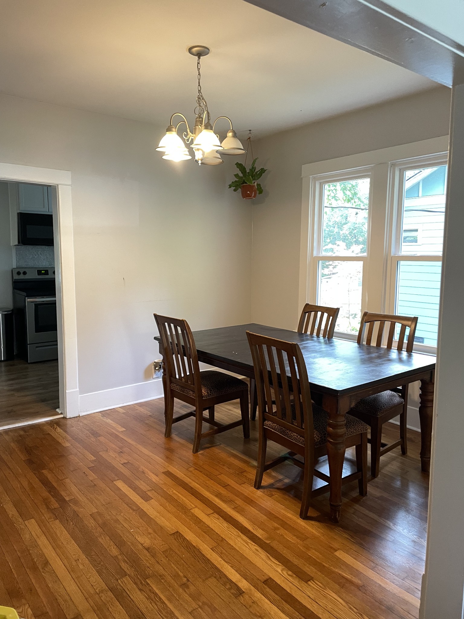807 Setliff Place Nashville, TN 37206 - Photo 9 of 13 a view of a dining room with furniture wooden floor and chandelier