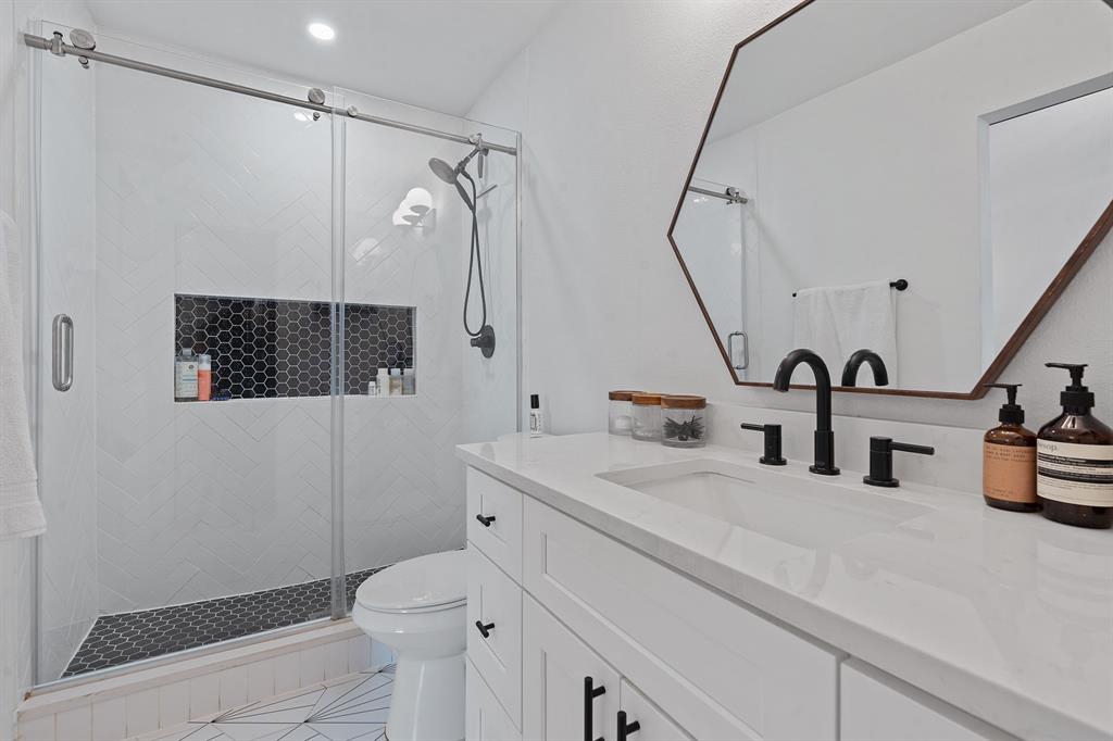 4902 Carsonhill Drive Austin, TX 78723 - Photo 14 of 19 Full bath with vanity and a stall shower