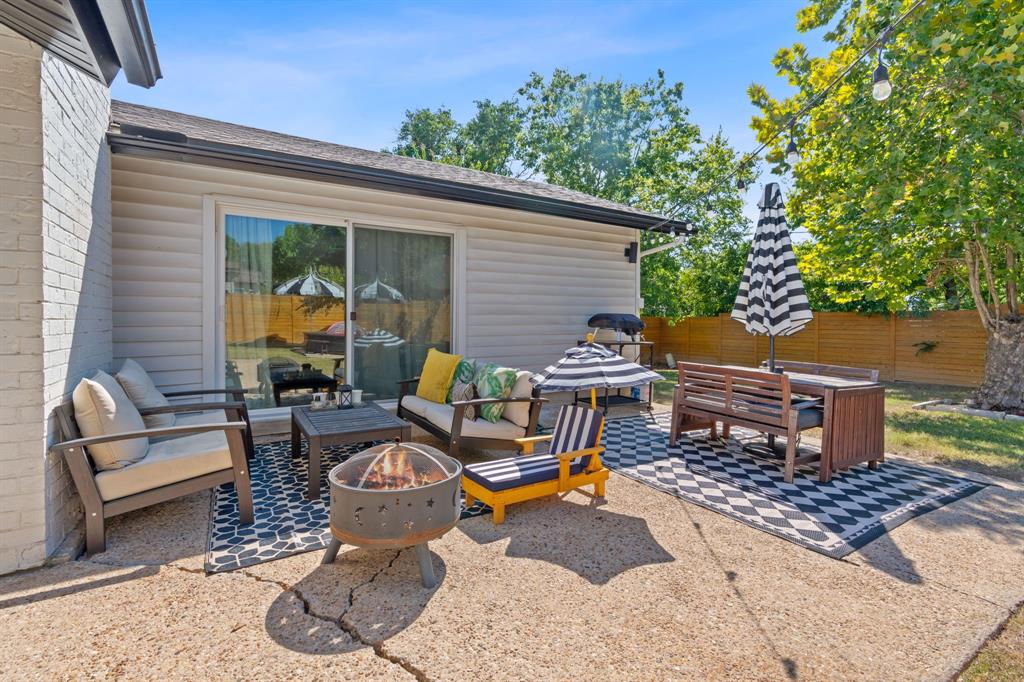 4902 Carsonhill Drive Austin, TX 78723 - Photo 17 of 19 View of patio with an outdoor living space with a fire pit