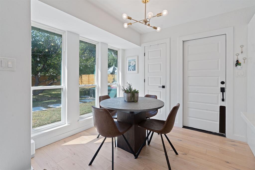 4902 Carsonhill Drive Austin, TX 78723 - Photo 7 of 19 Dining area featuring a chandelier and light wood-type flooring