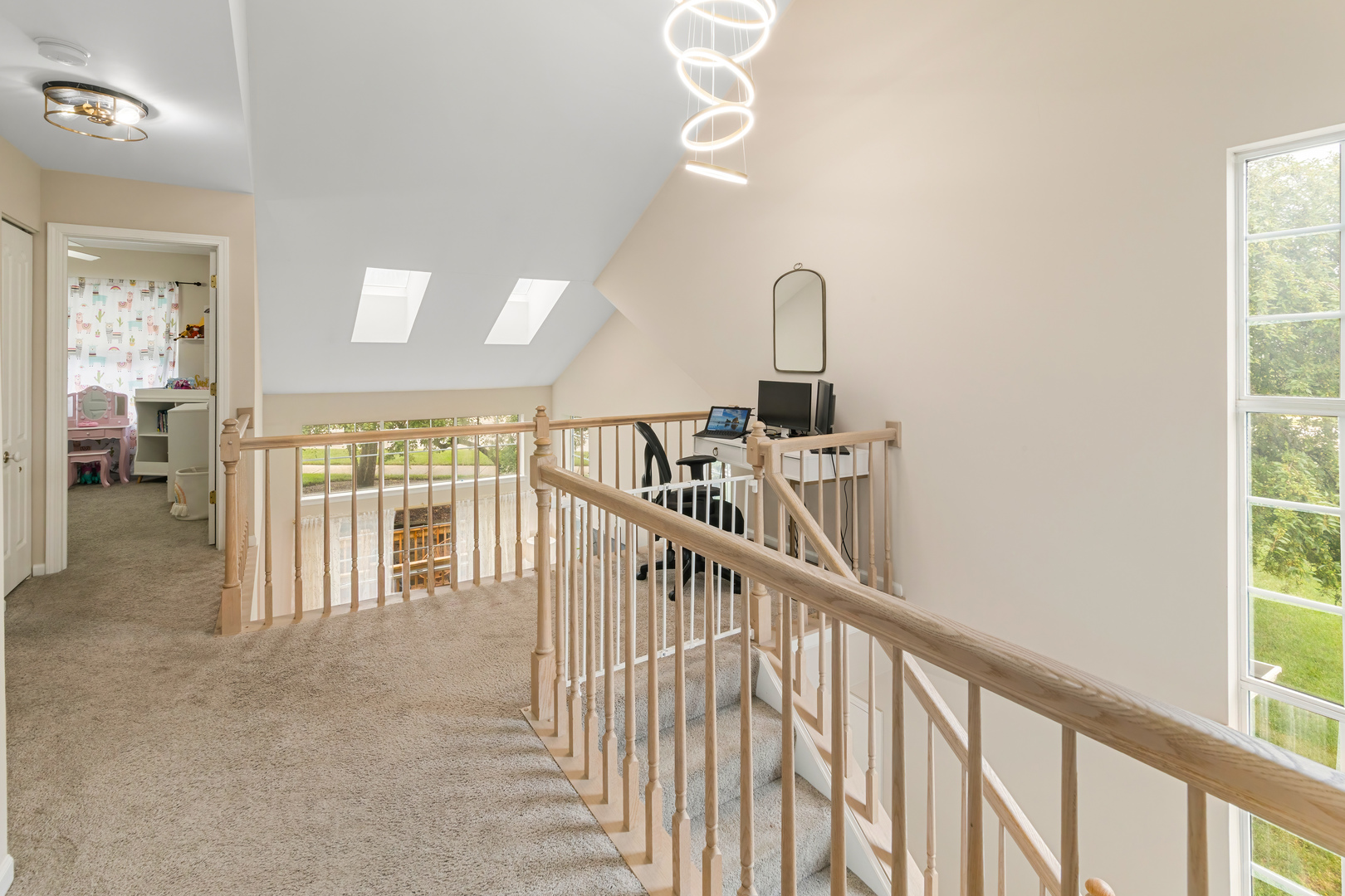 2140 Seaver Lane Hoffman Estates, IL 60169 - Photo 16 of 25 a view of staircase with lots of frames on wall and windows