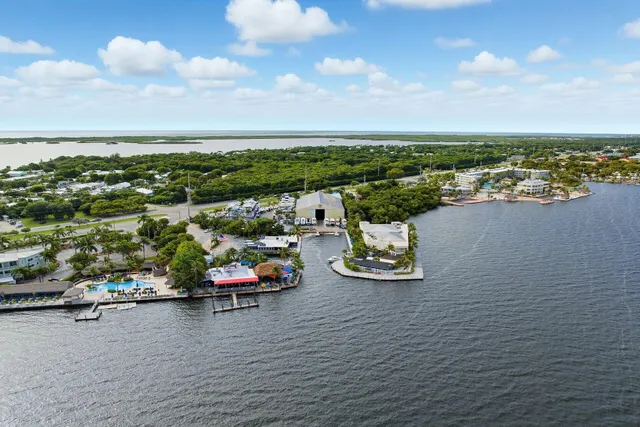 a view of a lake with a table and chairs