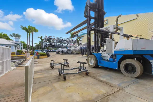 a view of a patio with dining table and chairs